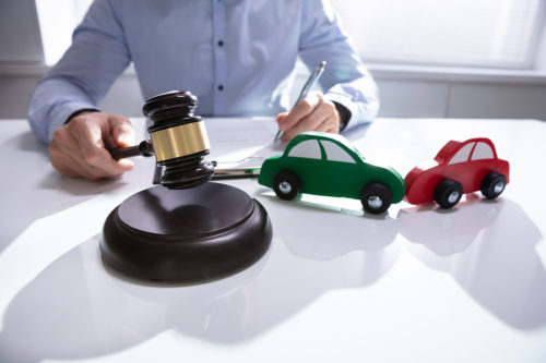 Car Accident Lawyer Lawyer with gavel and cars